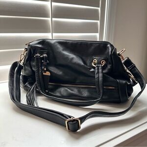 Women’s black purse with gold hardware